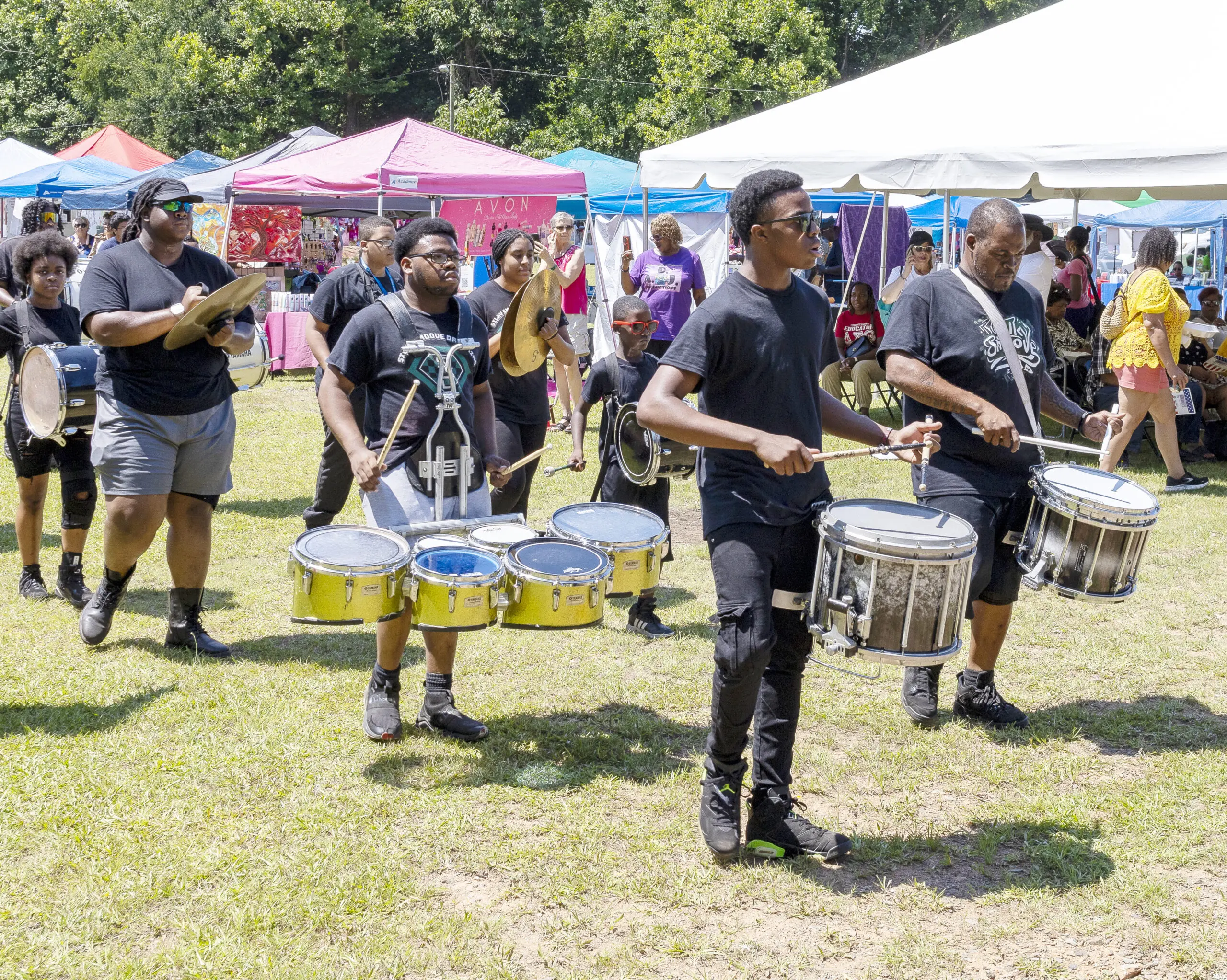 A Black drumline performs at a festival
